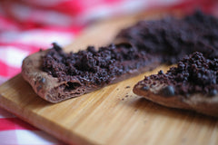 Chocolate covered pizza on a wooden pizza peel