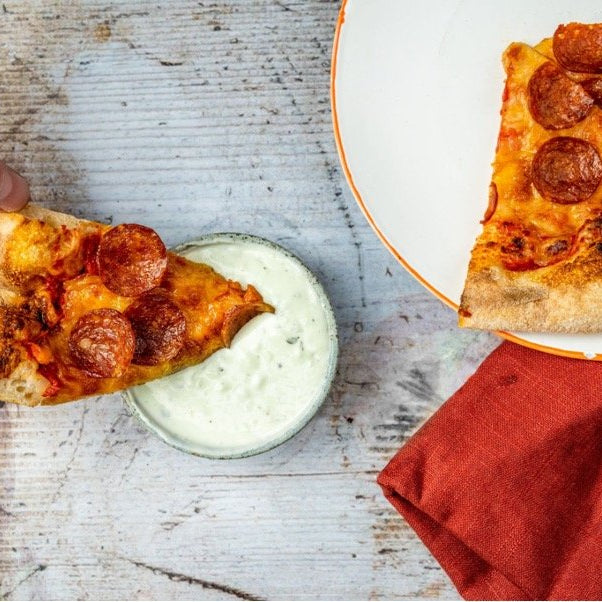 Pizza with a creamy blue cheese dip