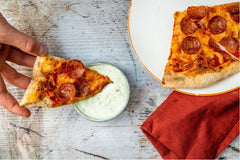 Pizza with a creamy blue cheese dip
