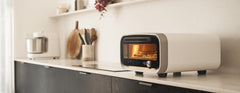 Polar white Ooni Volt 2 oven on a kitchen worktop
