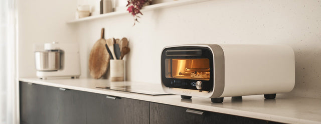 Polar white Ooni Volt 2 oven on a kitchen worktop