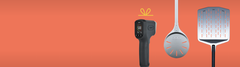 line up of infrared thermometer, turning peel and perforated pizza peel