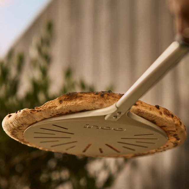 view from below of wide 9" pizza turning peel 