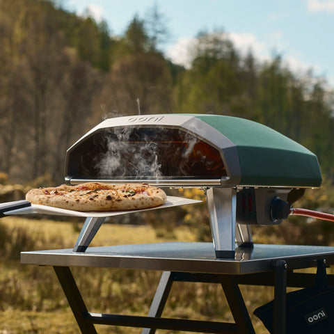 Koda 2 highland green on folding table. with wild outdoors background