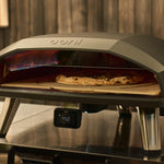 lifestyle asset of the Koda 2 Max with rotating stone with pizza in oven cooking
