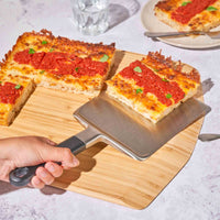 Ooni Pan Pizza Spatula on Ooni Bamboo Serving Peel