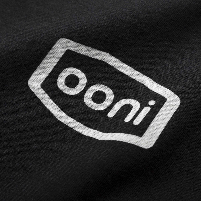 Ooni Badge T-shirt – Adult (Black) - Ooni United Kingdom | Click this image to open up the product gallery modal. The product gallery modal allows the images to be zoomed in on.