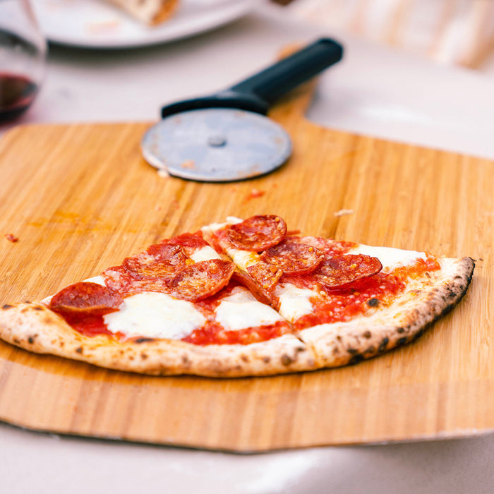 Ooni 12″ Bamboo Pizza Peel & Serving Board | Click this image to open up the product gallery modal. The product gallery modal allows the images to be zoomed in on.