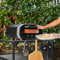 Ooni Volt 12 Electric Pizza Oven on table outdoors